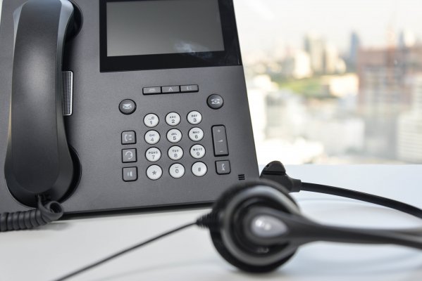 axvoice voip service overview headset black phone on desk